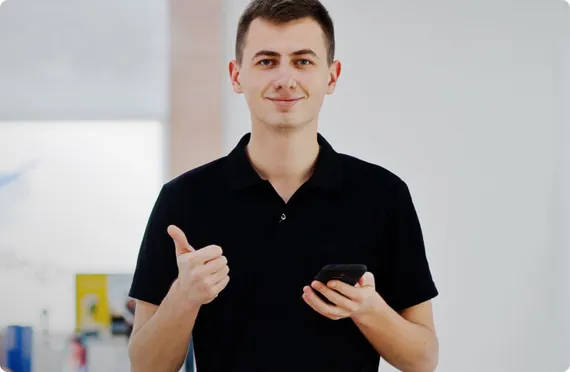 Young man giving a thumbs up